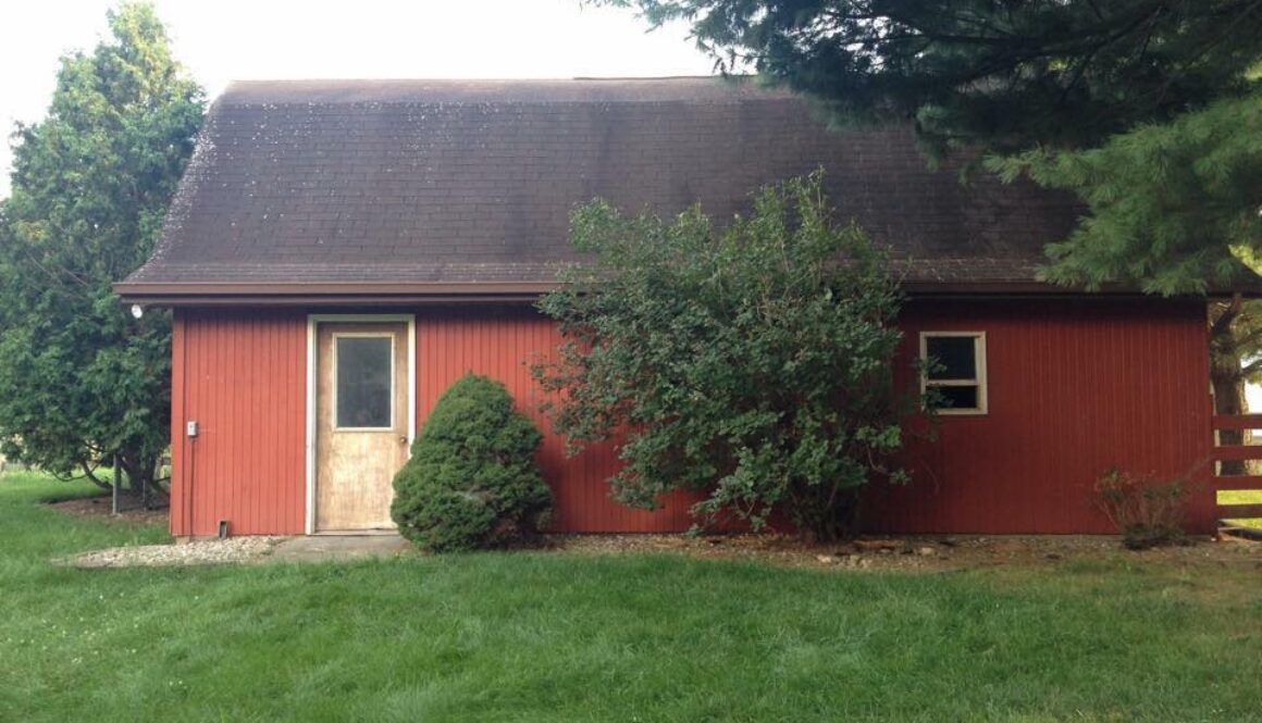 The Outside View of a barn in a Lawn