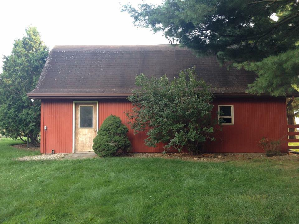 The Outside View of a barn in a Lawn